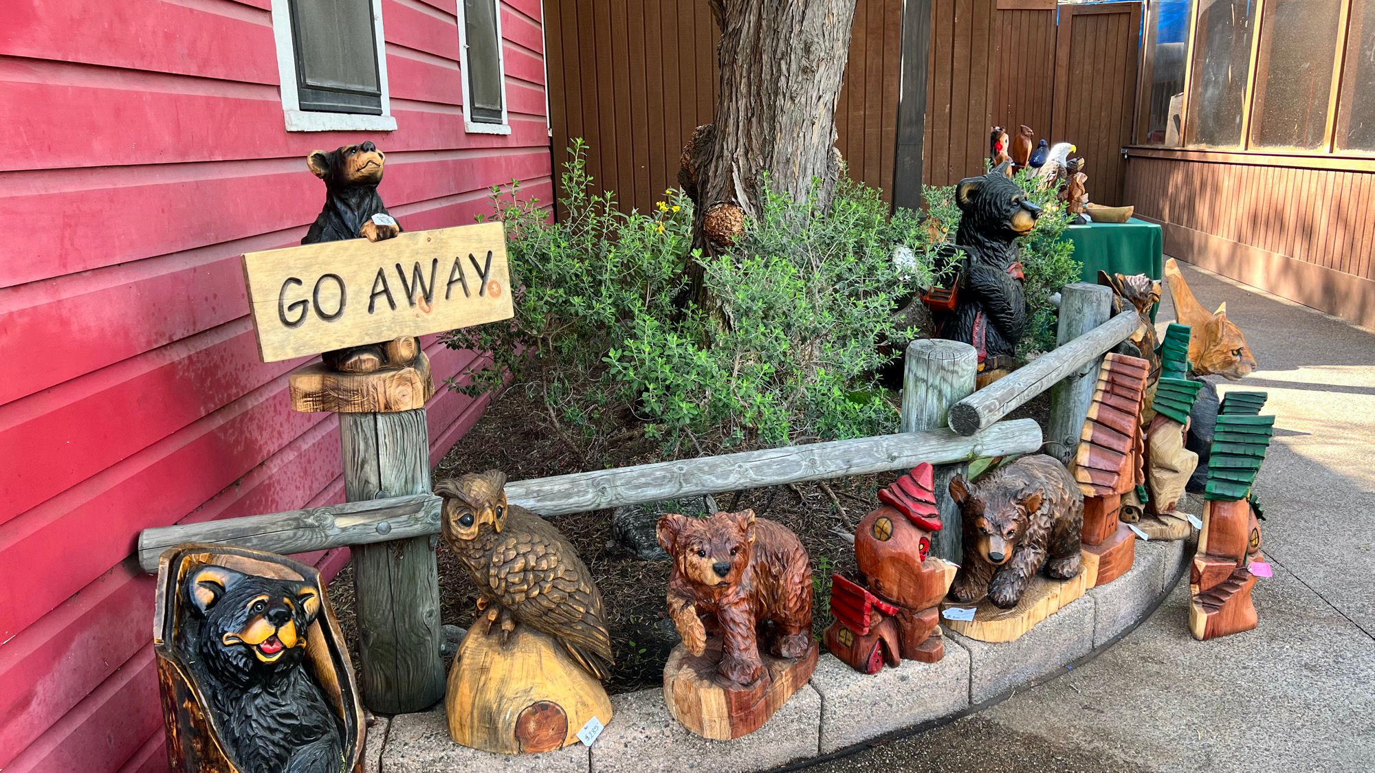 Wood Sculptures Booth Go Away Sign