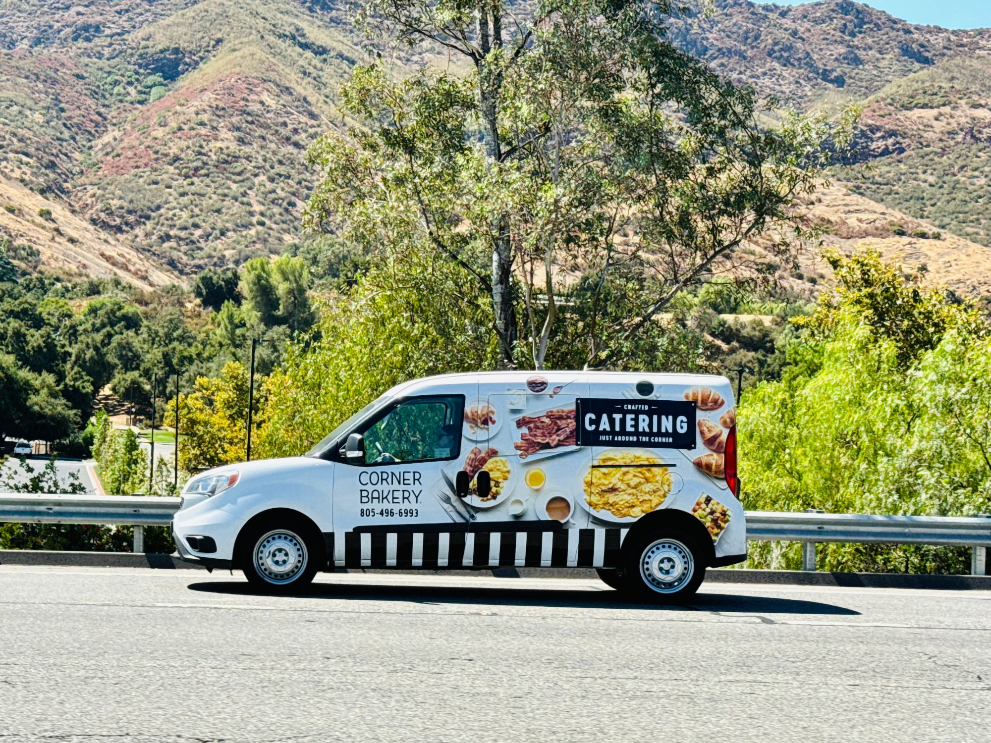 Corner Bakery Cafe Van on Freeway